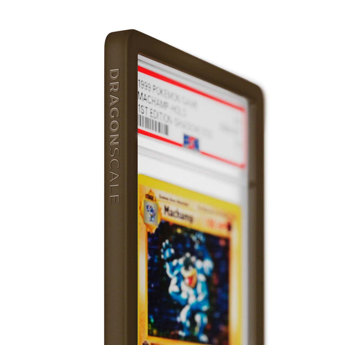 Close up logo zoom view of a PSA slab in Solid Brown Dragonscale bumper guard, featuring a Machamp 1st Edition Base Set PSA 10 Pokemon card.