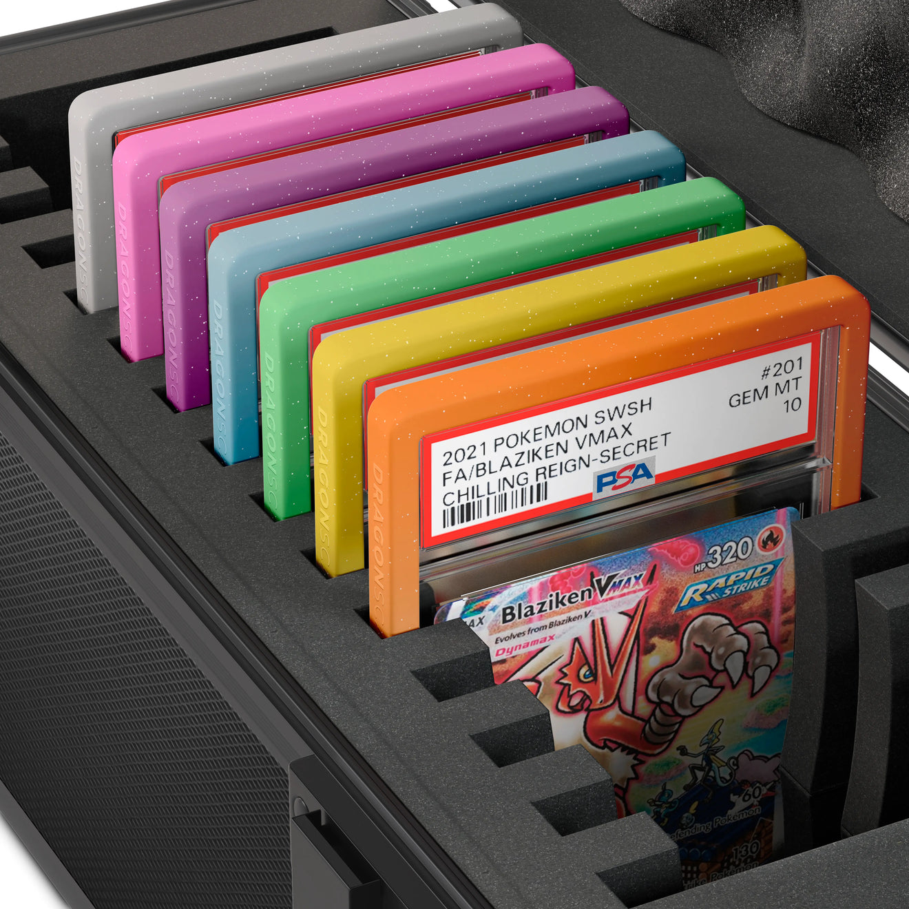 Close-up of the Dragonscale X-15 Precision metal slab case in carbon black foam slot securely holding PSA slabs with Dragonscale guards.