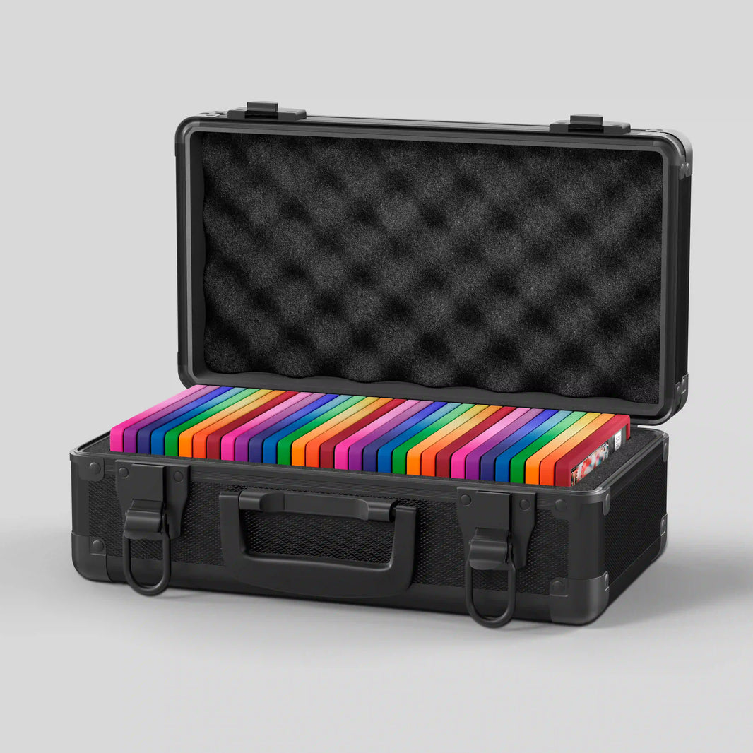Open view of the Dragonscale Basilisk X-40 Compact metal slab case in carbon black holding 32 PSA slabs with Dragonscale guards.