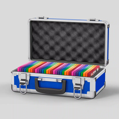 Open view of the Dragonscale Basilisk X-40 Compact metal slab case in sapphire blue holding 32 PSA slabs with Dragonscale guards.