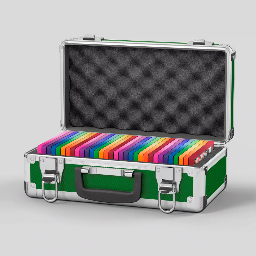 Open view of the Dragonscale Basilisk X-40 Compact metal slab case in emerald green holding 32 PSA slabs with Dragonscale guards.