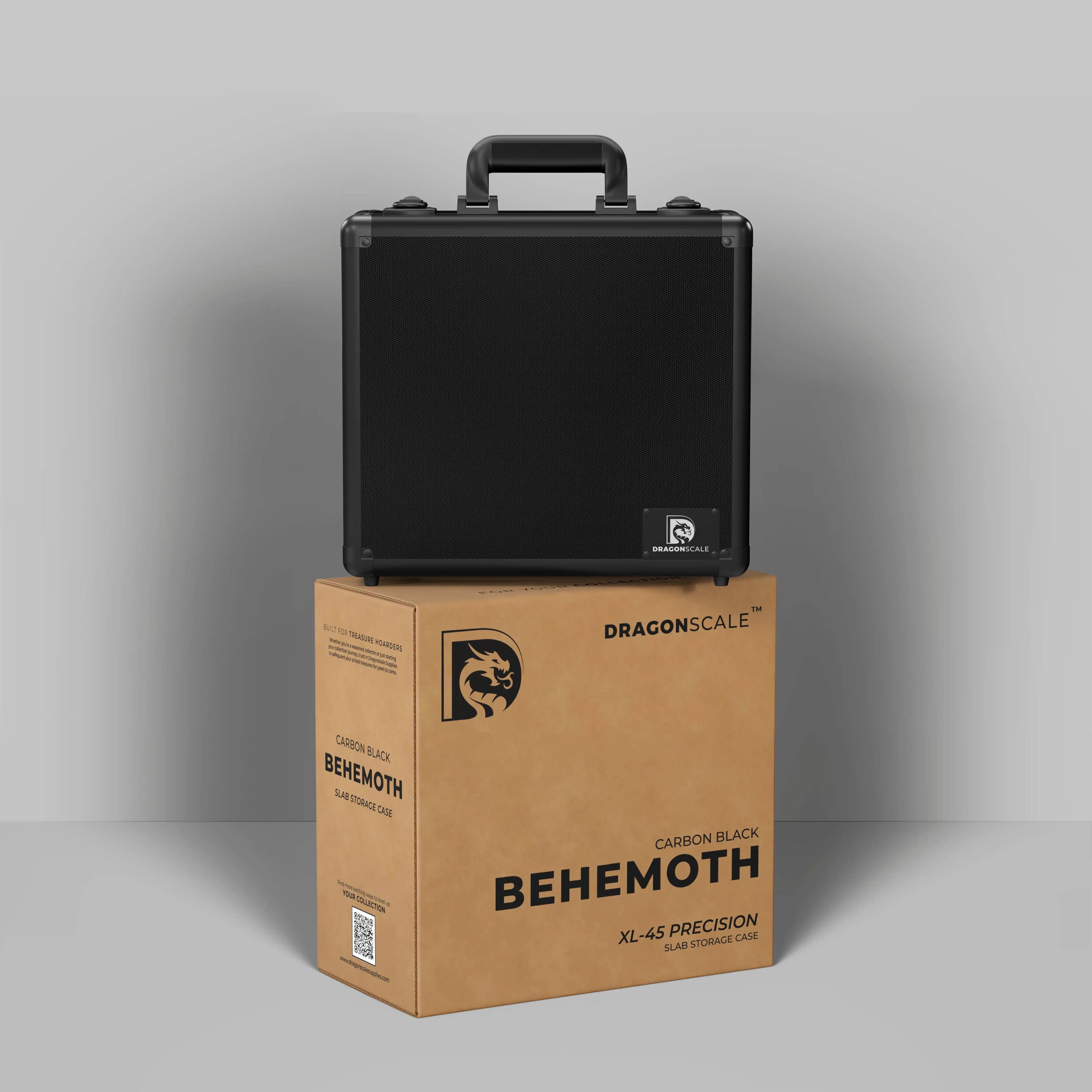 Display and demo view of the Dragonscale Behemoth XL-45 metal slab case in carbon black, placed on top of its branded cardboard packaging box.