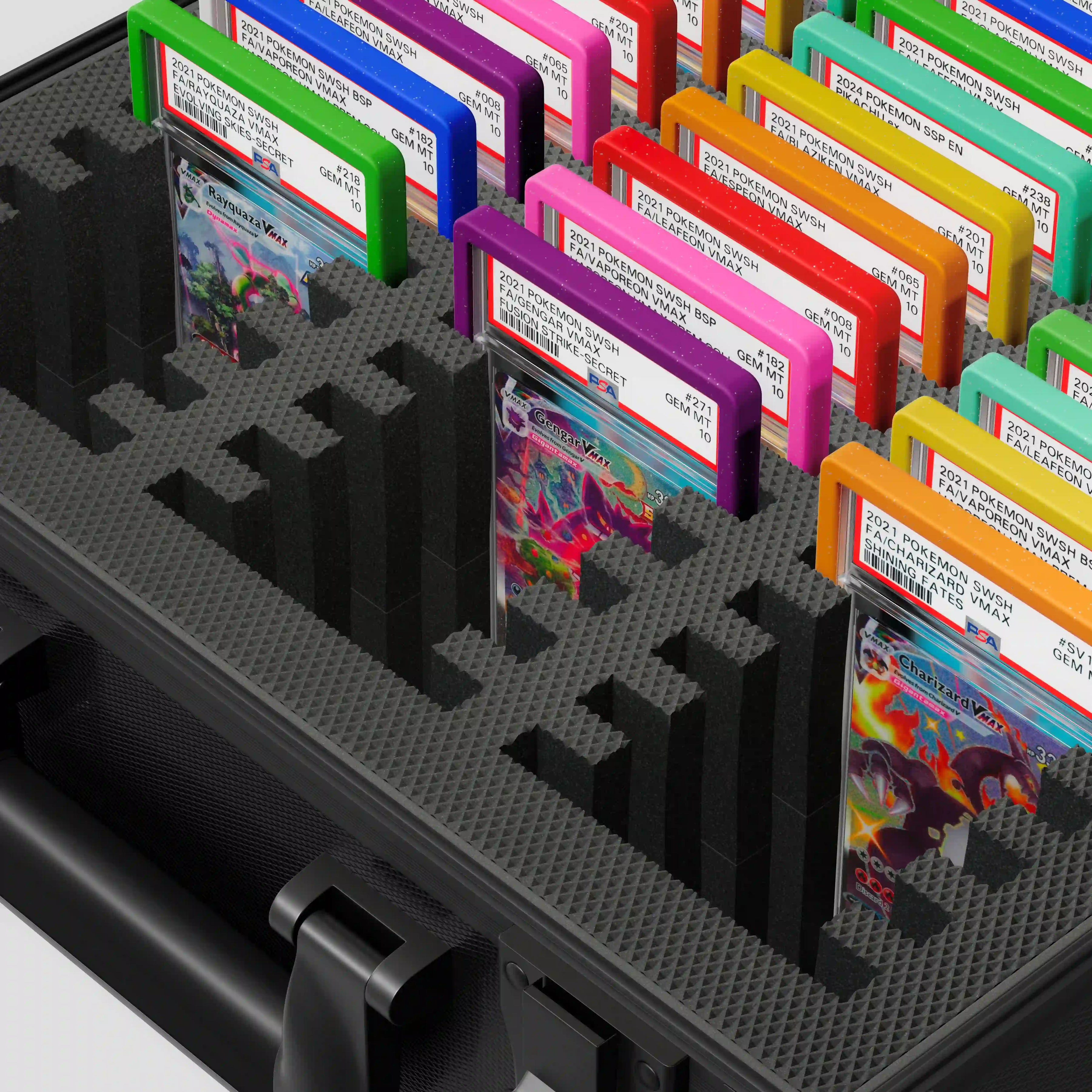 Close-up of the Dragonscale Behemoth XL-45 metal slab case in carbon black foam slot securely holding PSA slabs with Dragonscale guards.