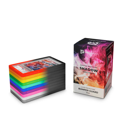 Boxed set view of the Dragonscale  Shadow Spectrum bumper booster box, featuring a display packaging box alongside a stack of 10-pack PSA bumper guards.