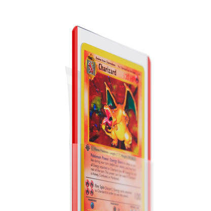 Close-up of 1st Edition Base Set Charizard being inserted into a clear Dragonscale PSA Toploader sleeve protector.