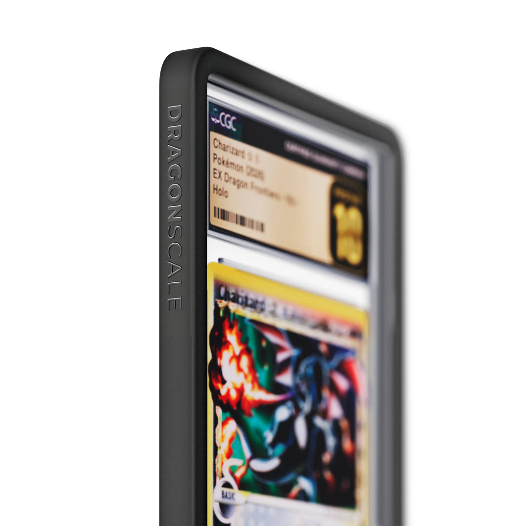 Close up logo zoom view of a CGC slab in Solid Black Dragonscale bumper guard, featuring a Charizard Gold Star Ex Dragon Frontiers CGC 10 Pokemon card.
