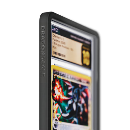 Close up logo zoom view of a CGC slab in Solid Black Dragonscale bumper guard, featuring a Charizard Gold Star Ex Dragon Frontiers CGC 10 Pokemon card.

