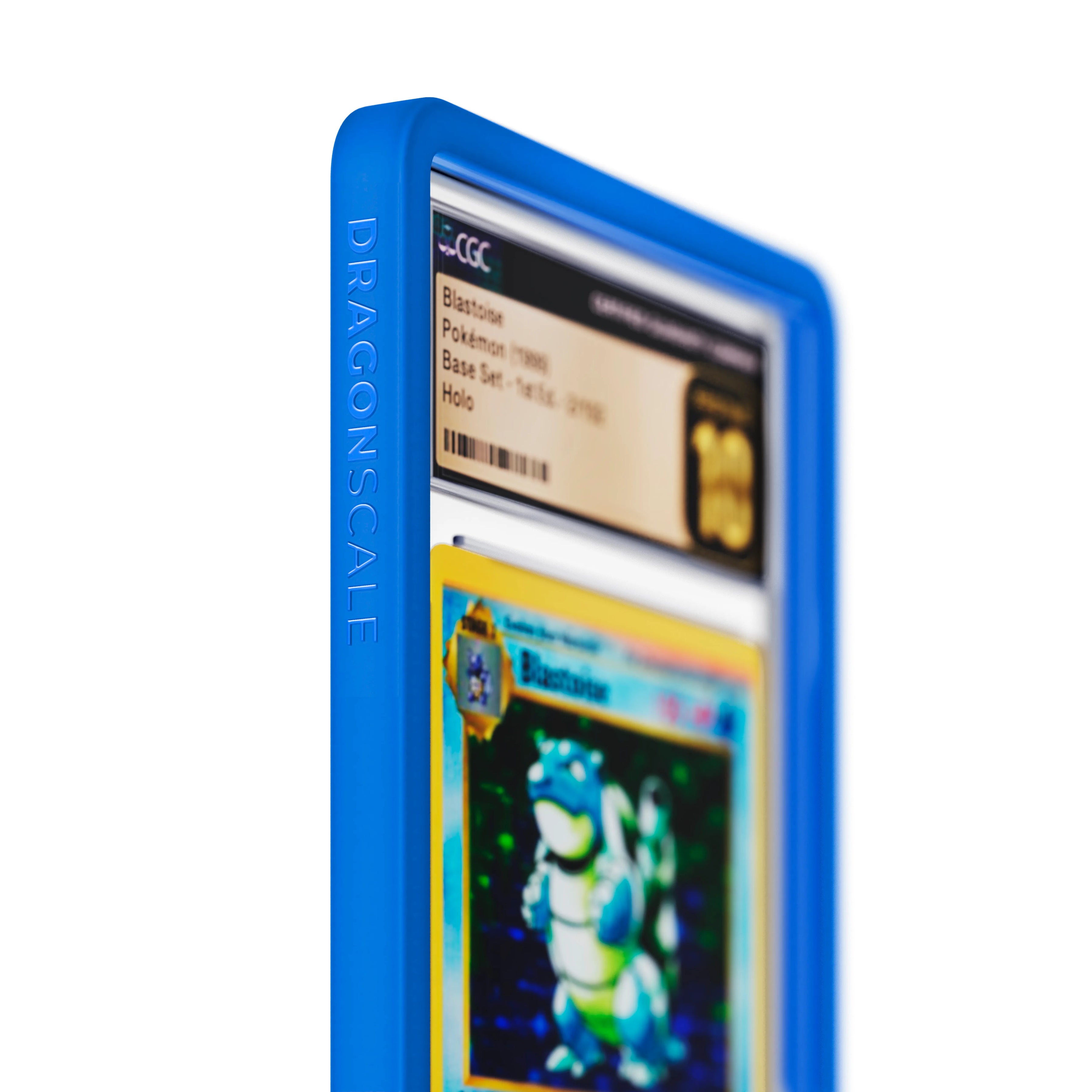 Close up logo zoom view of a CGC slab in Solid Blue Dragonscale bumper guard, featuring a Blastoise 1st Edition Base Set CGC 10 Pokemon card.
