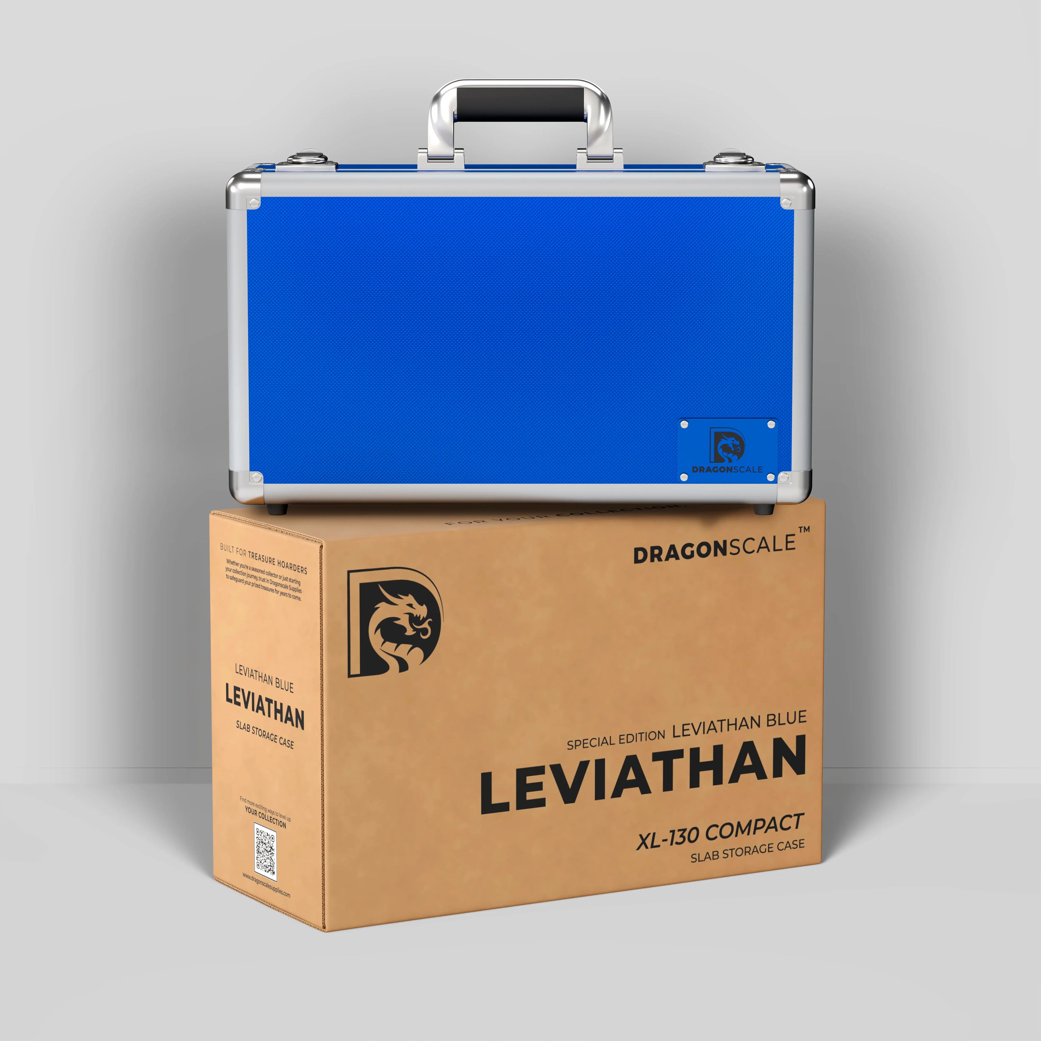 Display and demo view of the Dragonscale Leviathan XL-130 Compact metal slab case in leviathan blue, placed on top of its branded cardboard packaging box.