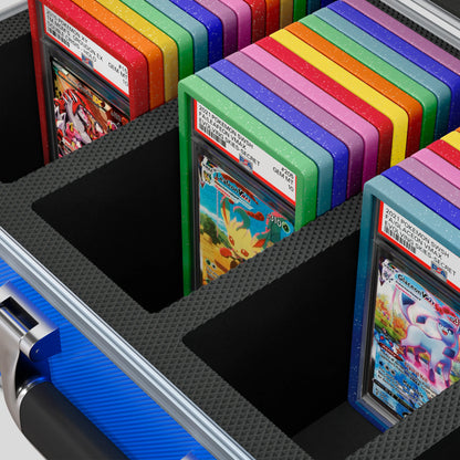 Close-up of the  Dragonscale Leviathan XL-130 Compact metal slab case in leviathan blue foam slot securely holding PSA slabs with Dragonscale guards.