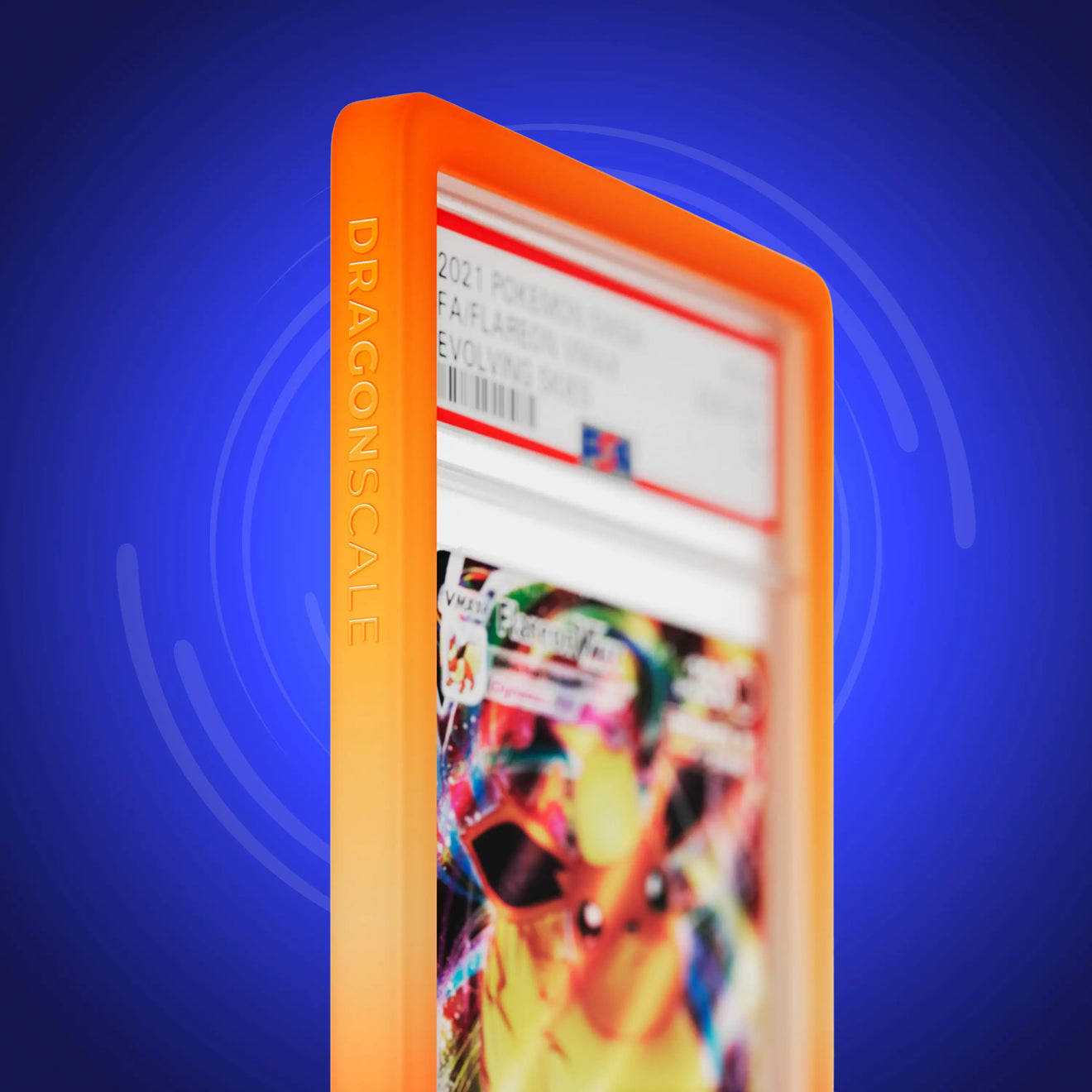 Close up logo zoom view of a PSA slab in Gradient Blaze Dragonscale bumper guard, featuring a Flareon VMAX Evolving Skies PSA 10 Pokemon card.