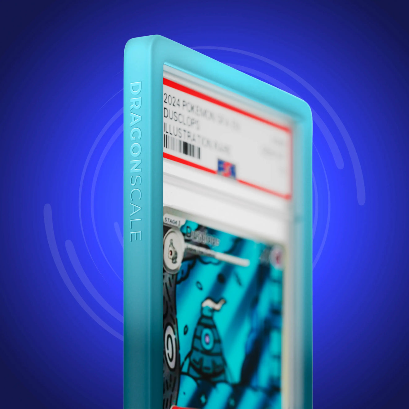 Close up logo zoom view of a PSA slab in Gradient Ethereal Dragonscale bumper guard, featuring a Dusclops Shrouded Fable PSA 10 Pokemon card.