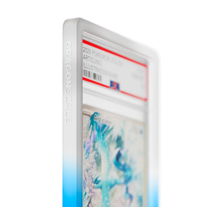 Close up logo zoom view of a PSA slab in Gradient Frost Dragonscale bumper guard, featuring a Articuno Journey Together PSA 10 Pokemon card.