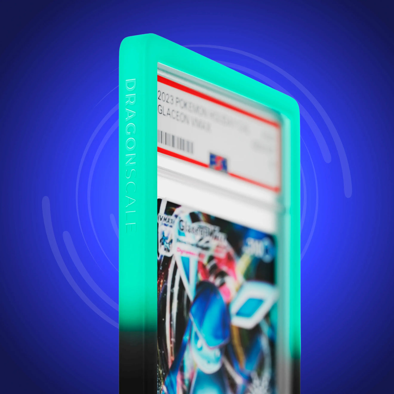 Close up logo zoom view of a PSA slab in Gradient Spectral Dragonscale bumper guard, featuring a Glaceon VMAX Holiday Calendar 2023 PSA 10 Pokemon card.