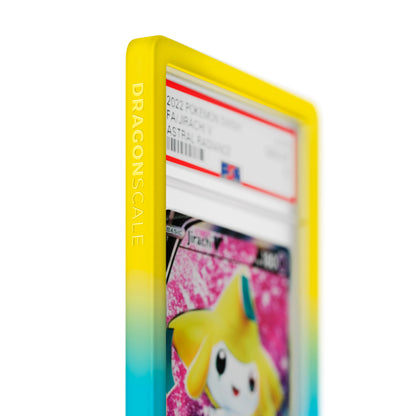 Close up logo zoom view of a PSA slab in Gradient Wish Dragonscale bumper guard, featuring a Jirachi V Astral Radiance PSA 10 Pokemon card.