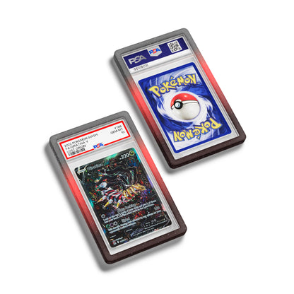 Top-down flat view of a PSA slab in Mythic Corruption Dragonscale bumper guard, featuring a Giratina V Lost Origin PSA 10 Pokemon card.
