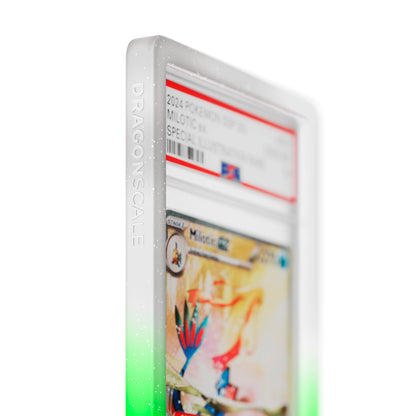 Close up logo zoom view of a PSA slab in Radiant Sylvan Dragonscale bumper guard, featuring a Milotic EX Surging Sparks PSA 10 Pokemon card.