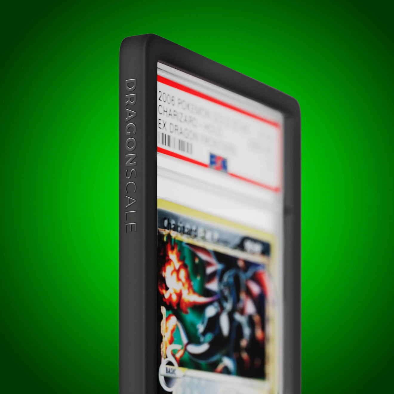 Close up logo zoom view of a PSA slab in Solid Black Dragonscale bumper guard, featuring a Charizard Gold Star Ex Dragon Frontiers PSA 10 Pokemon card.