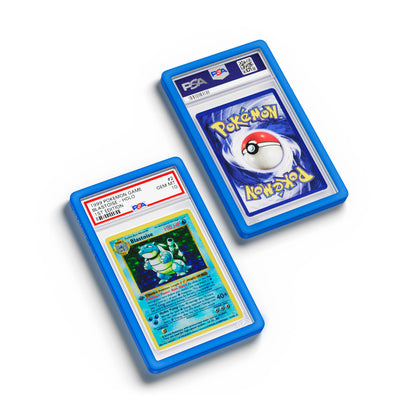Top-down flat view of a PSA slab in Solid Blue Dragonscale bumper guard, featuring a Blastoise 1st Edition Base Set PSA 10 Pokemon card.
