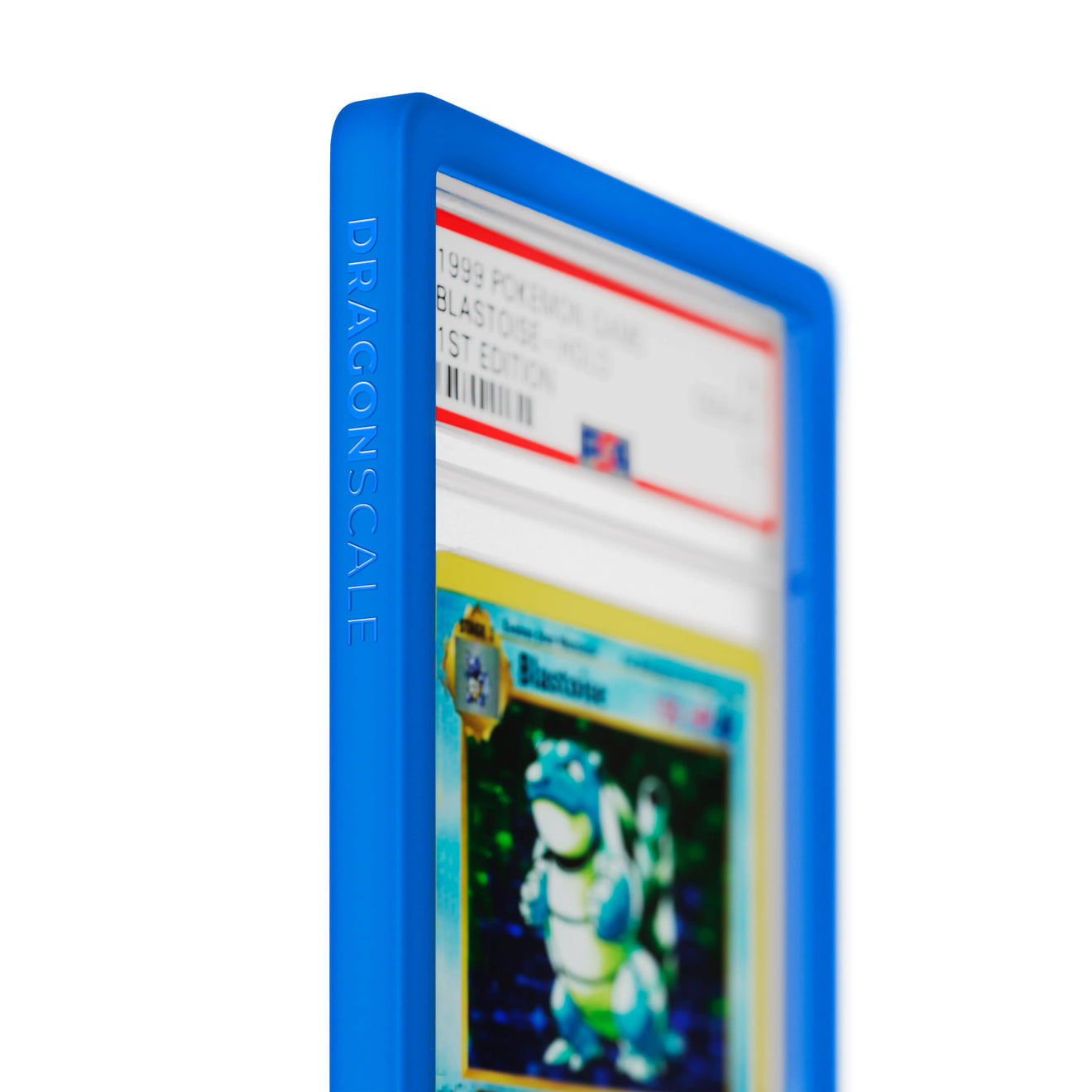 Close up logo zoom view of a PSA slab in Solid Blue Dragonscale bumper guard, featuring a Blastoise 1st Edition Base Set PSA 10 Pokemon card.