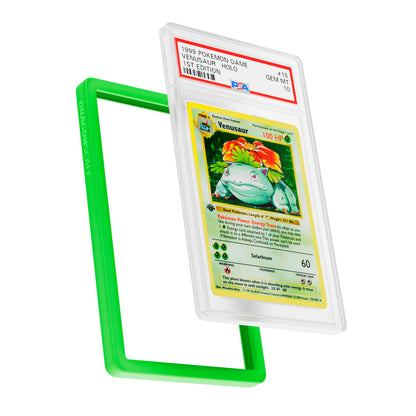 
Display and demo view of a PSA slab in Solid Green Dragonscale bumper guard, featuring a Venusaur 1st Edition Base Set PSA 10 Pokemon card.
