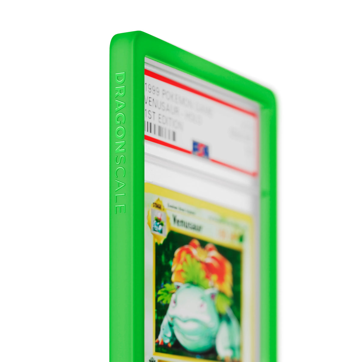 Close up logo zoom view of a PSA slab in Solid Green Dragonscale bumper guard, featuring a Venusaur 1st Edition Base Set PSA 10 Pokemon card.
