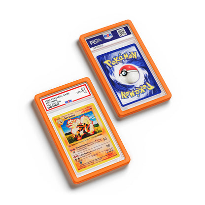 Top-down flat view of a PSA slab in Solid Orange Dragonscale bumper guard, featuring a Arcanine 1st Edition Base Set PSA 10 Pokemon card.