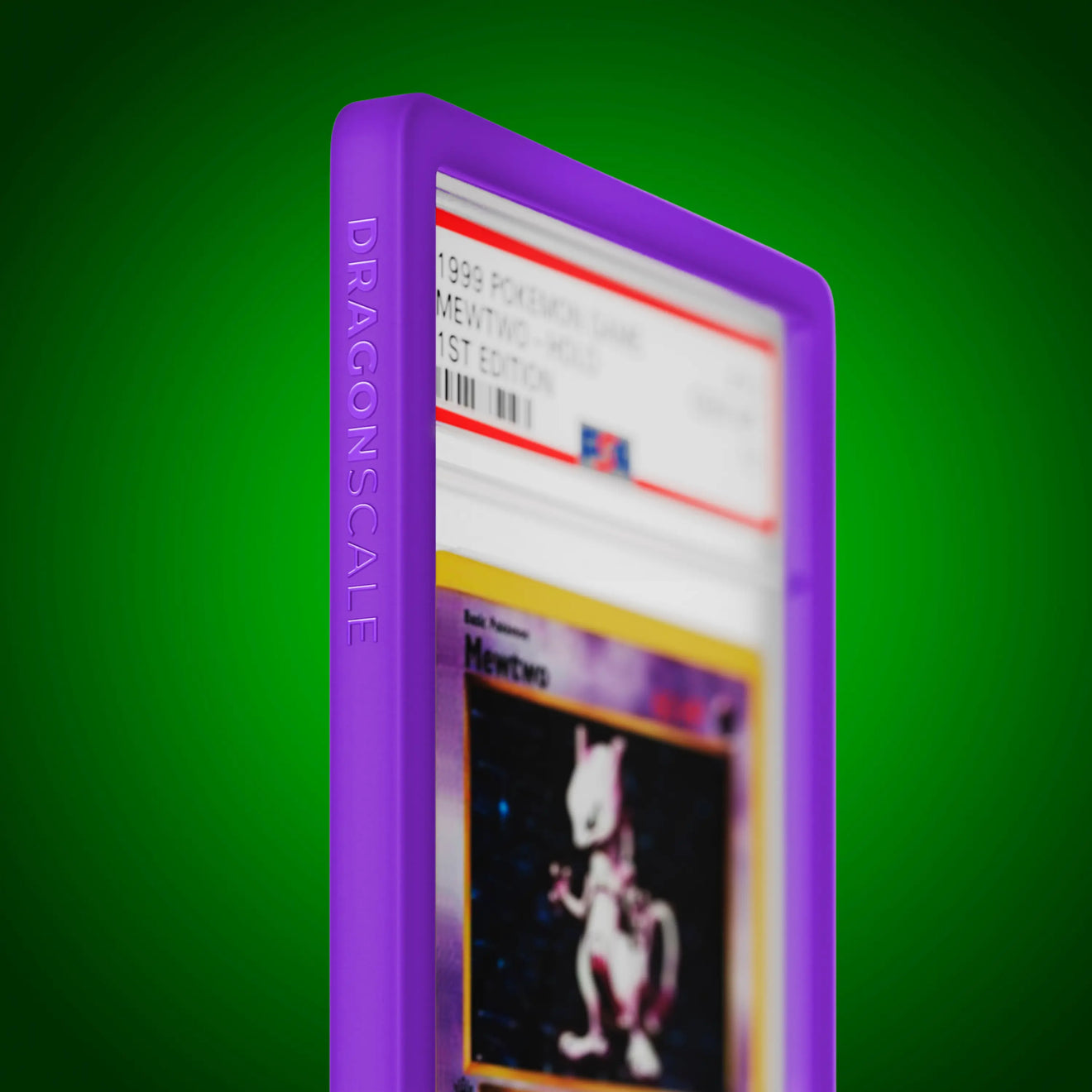 Close up logo zoom view of a PSA slab in Solid Purple Dragonscale bumper guard, featuring a Mewtwo 1st Edition Base Set PSA 10 Pokemon card.