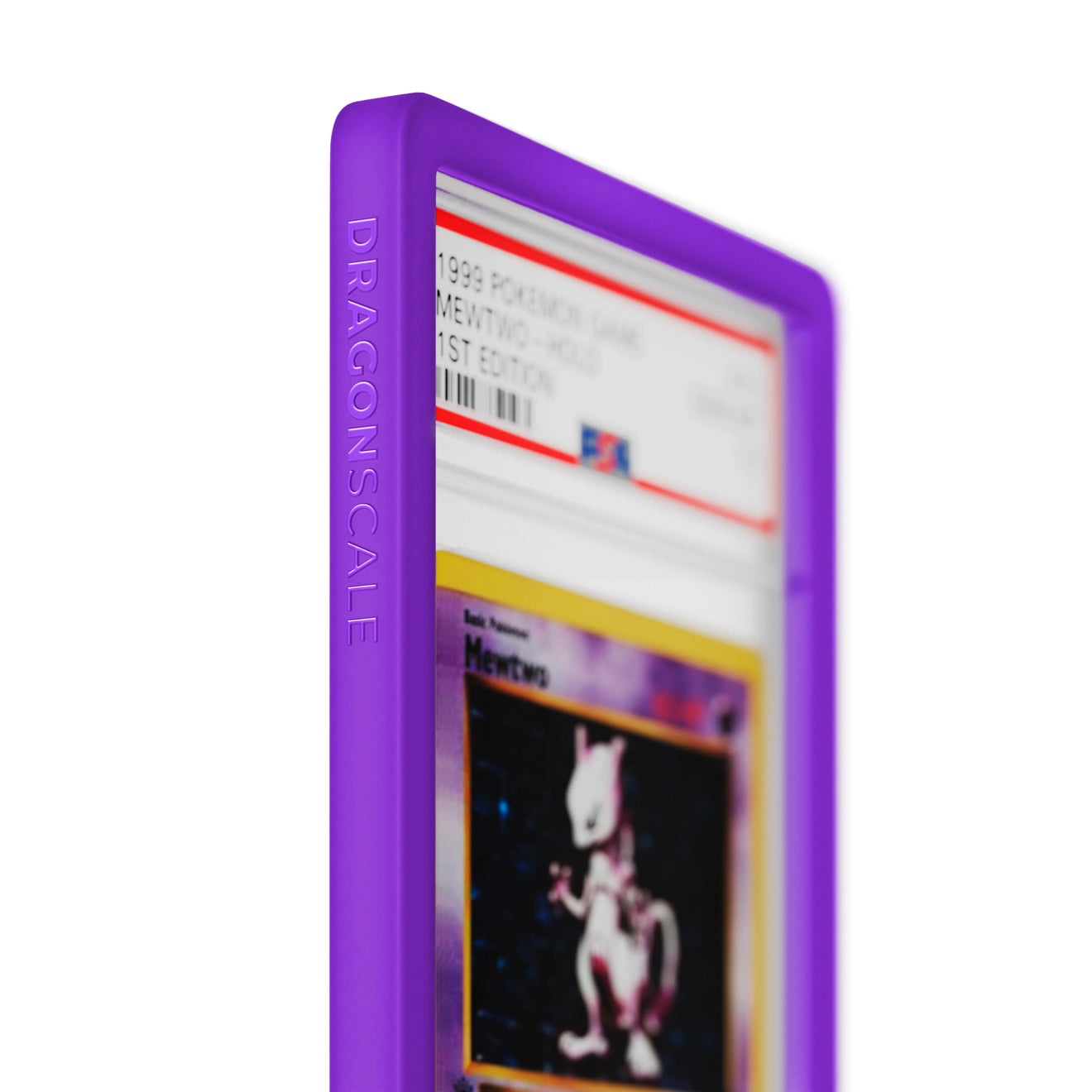Close up logo zoom view of a PSA slab in Solid Purple Dragonscale bumper guard, featuring a Mewtwo 1st Edition Base Set PSA 10 Pokemon card.