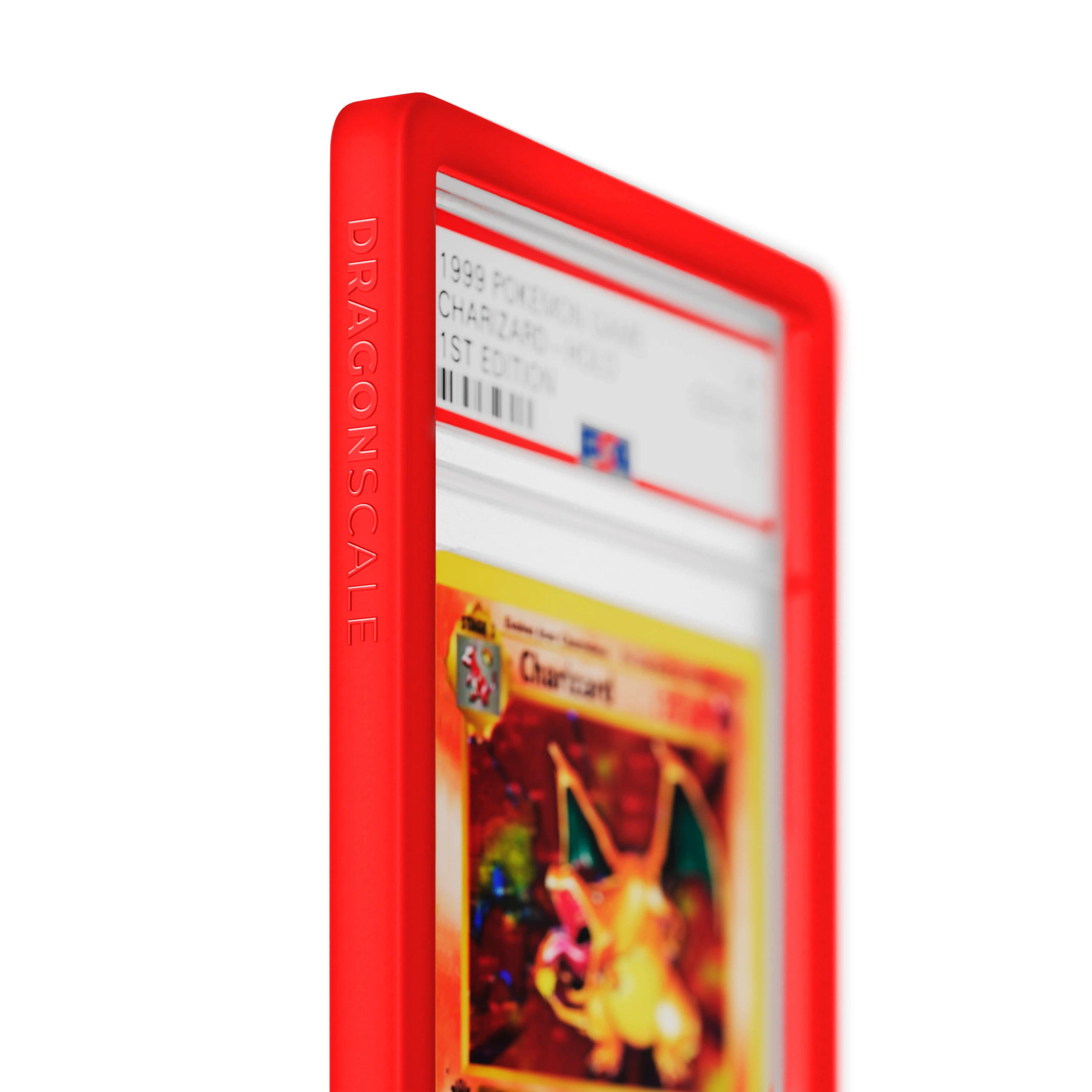 Close up logo zoom view of a PSA slab in Solid Red Dragonscale bumper guard, featuring a Charizard 1st Edition Base Set PSA 10 Pokemon card.