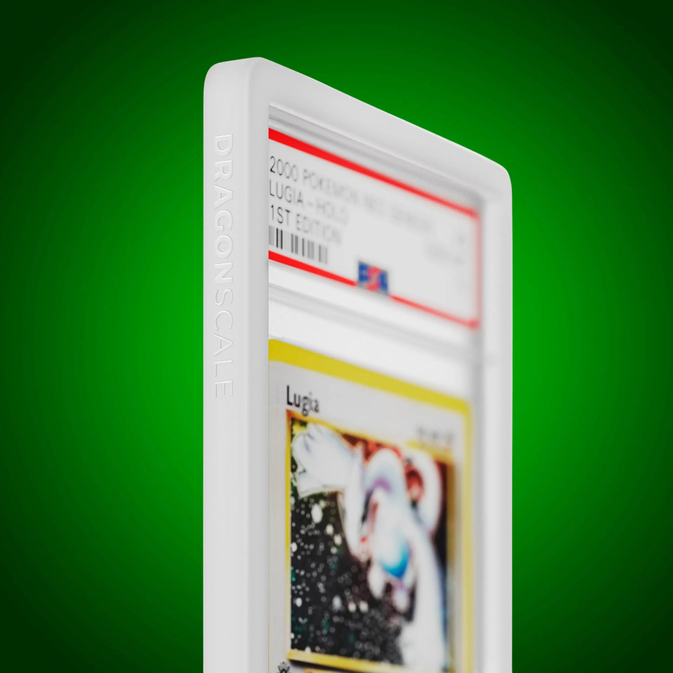 Close up logo zoom view of a PSA slab in Solid White Dragonscale bumper guard, featuring a Lugia Neo Genesis PSA 10 Pokemon card.