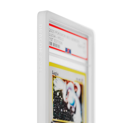Close up logo zoom view of a PSA slab in Solid White Dragonscale bumper guard, featuring a Lugia Neo Genesis PSA 10 Pokemon card.