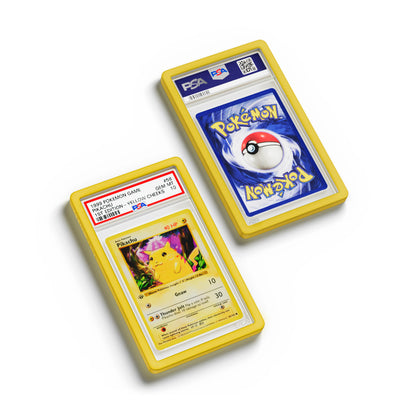 Top-down flat view of a PSA slab in Solid Yellow Dragonscale bumper guard, featuring a Pikachu 1st Edition Base Set PSA 10 Pokemon card.