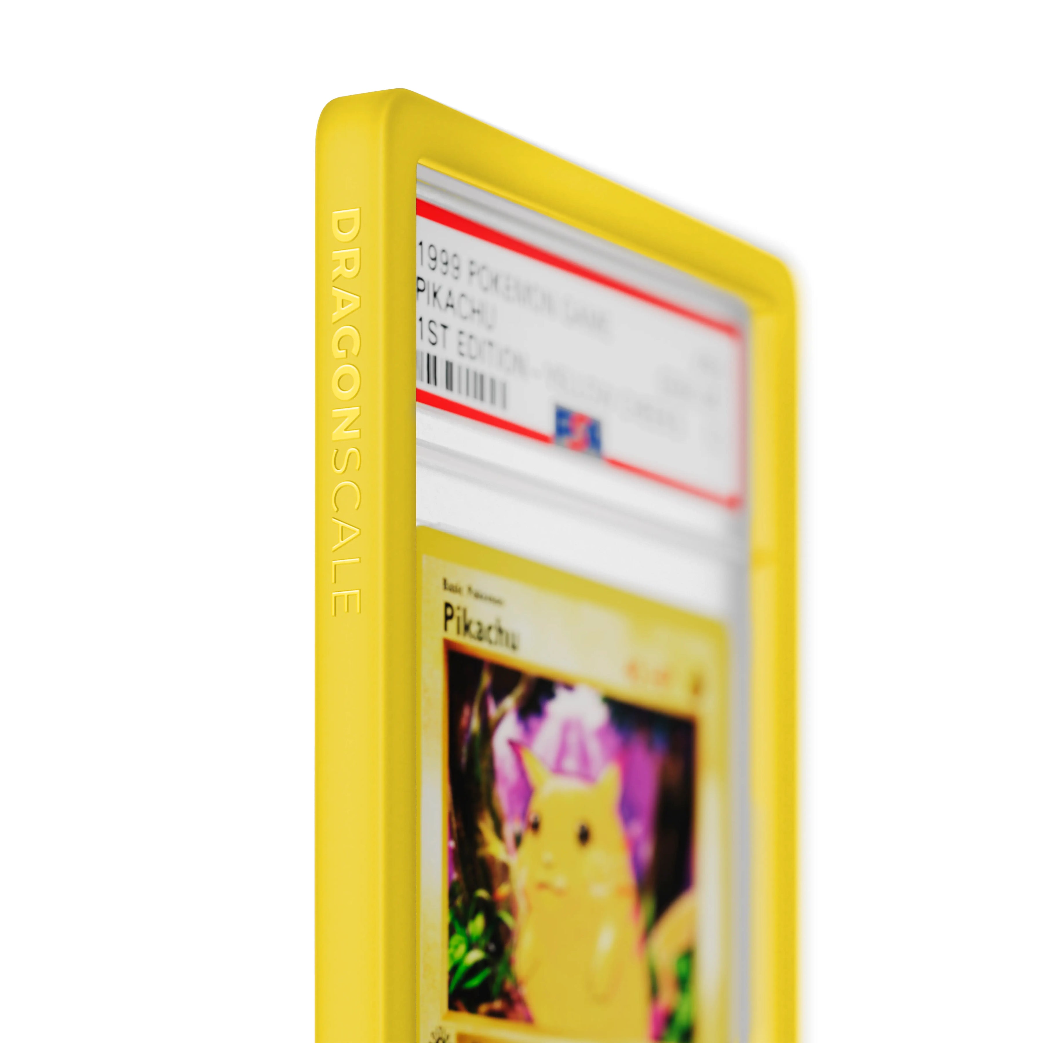 Close up logo zoom view of a PSA slab in Solid Yellow Dragonscale bumper guard, featuring a Pikachu 1st Edition Base Set PSA 10 Pokemon card.