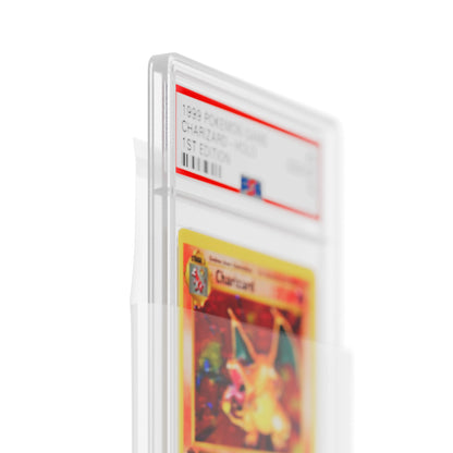 Close-up of 1st Edition Base Set Charizard PSA 10 slab being inserted into a clear Dragonscale PSA slab sleeve protector.