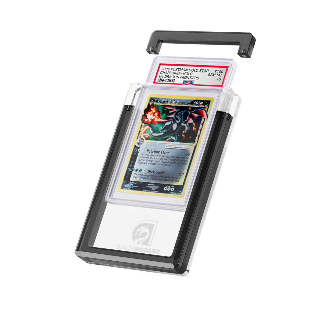 Angled display and demo view of the Dragonscale Wyrmgem Solid Onyx acrylic case, highlighting the acrylic lid and secure magnetic locks featuring a Charizard Gold Star Ex Dragon Frontiers PSA 10 Pokemon card.