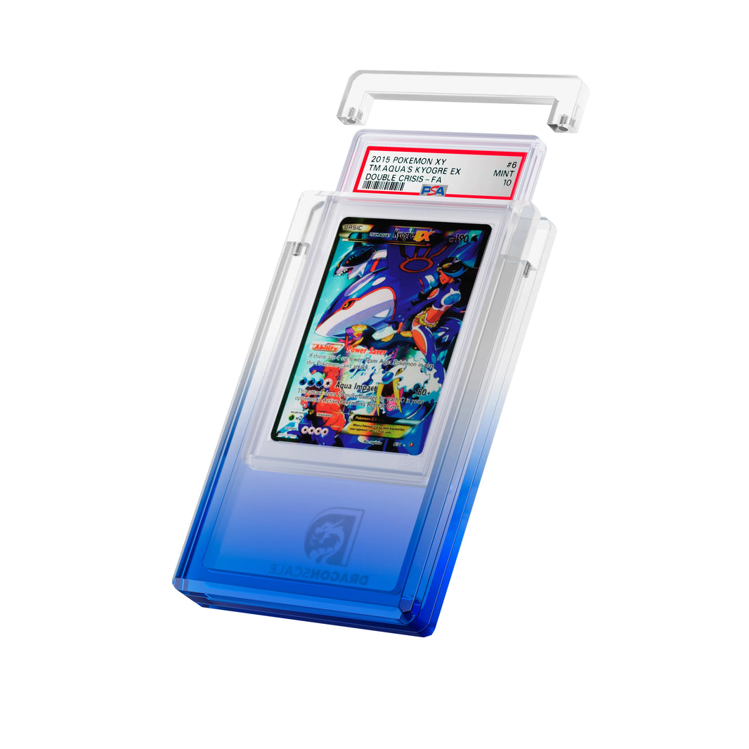 Angled display and demo view of the Dragonscale Wyrmgem Myst Sapphire acrylic case, highlighting the acrylic lid and secure magnetic locks featuring a Team Aqua’s Kyogre EX Double Crisis PSA 10 Pokemon card.