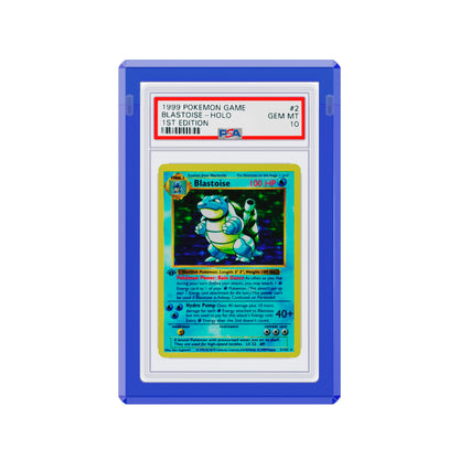Angled display and demo view of the Dragonscale Wyrmgem Solid Sapphire acrylic case, highlighting the acrylic lid and secure magnetic locks featuring a Blastoise 1st Edition Base Set PSA 10 Pokemon card.