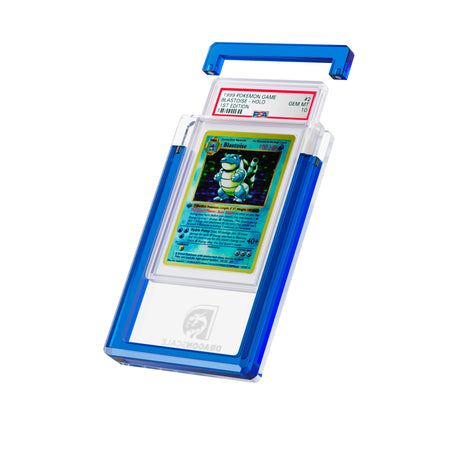 Angled display and demo view of the Dragonscale Wyrmgem Solid Sapphire acrylic case, highlighting the acrylic lid and secure magnetic locks featuring a Blastoise 1st Edition Base Set PSA 10 Pokemon card.