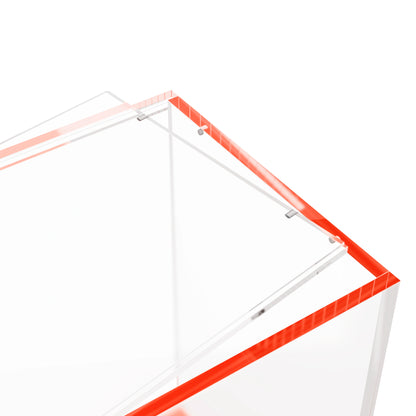 Close-up corner view of the Dragonscale WyrmPrism AB140L Red Ruby acrylic case, highlighting the acrylic lid and secure magnetic locks.