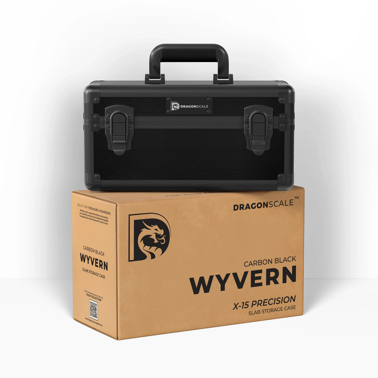 Display and demo view of the Dragonscale Wyvern X-15 Precision metal slab case in carbon black, placed on top of its branded cardboard packaging box.