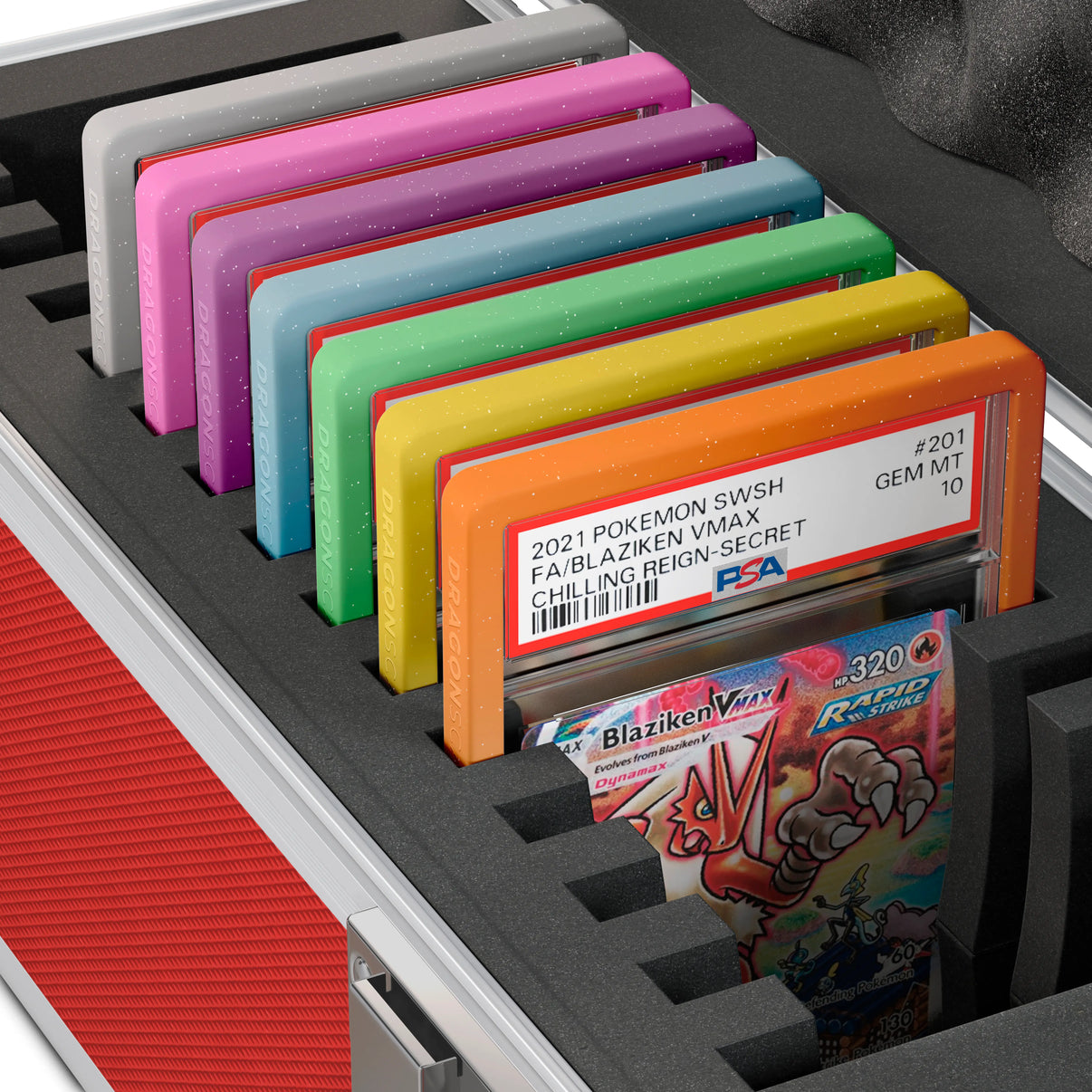 Close-up of the Dragonscale Wyvern X-15 Precision metal slab case in ruby red foam slot securely holding PSA slabs with Dragonscale guards.