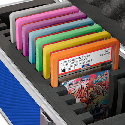 Close-up of the Dragonscale X-15 Precision metal slab case in sapphire blue foam slot securely holding PSA slabs with Dragonscale guards.