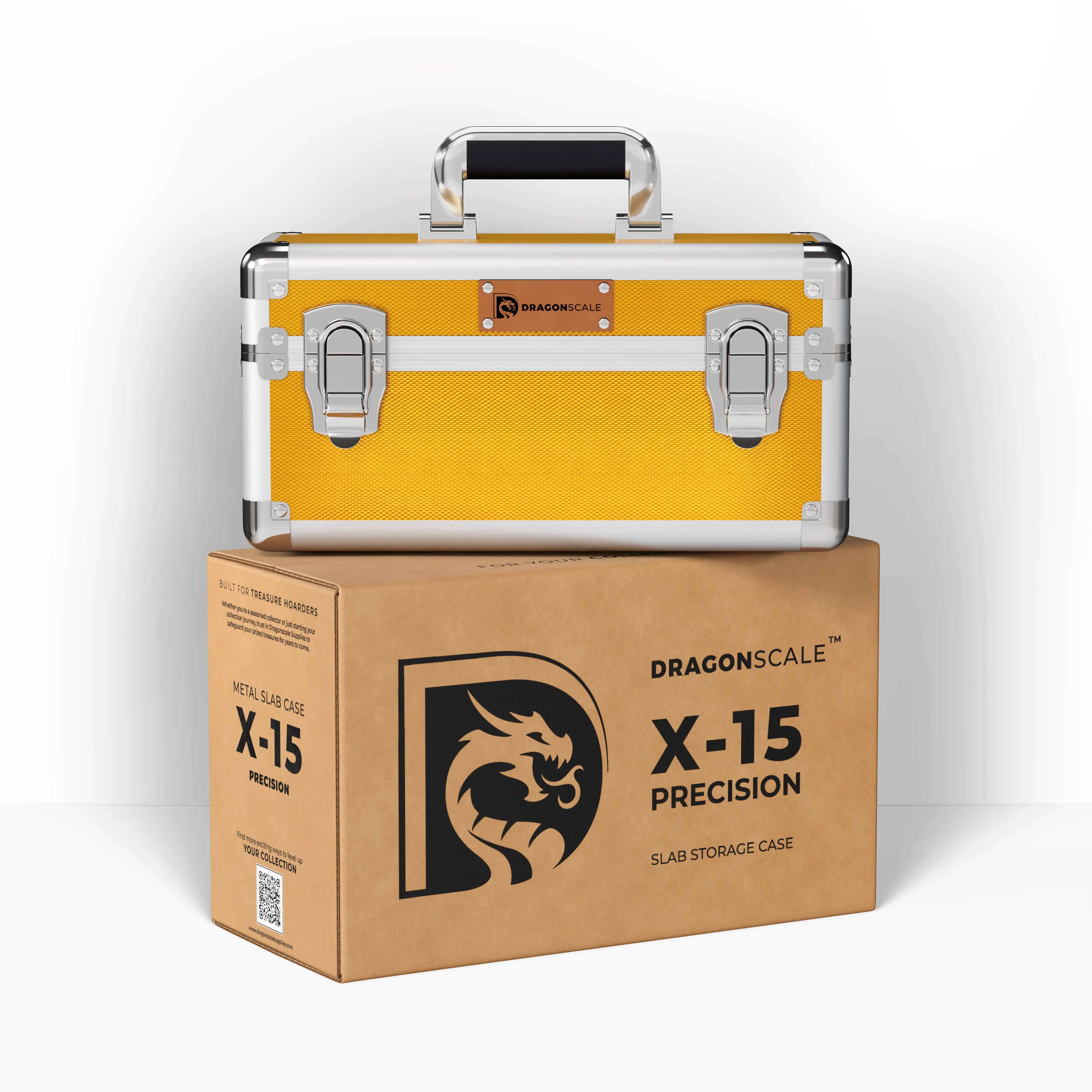 Display and demo view of the Dragonscale X-15 Precision metal slab case in shiny gold, placed on top of its branded cardboard packaging box.