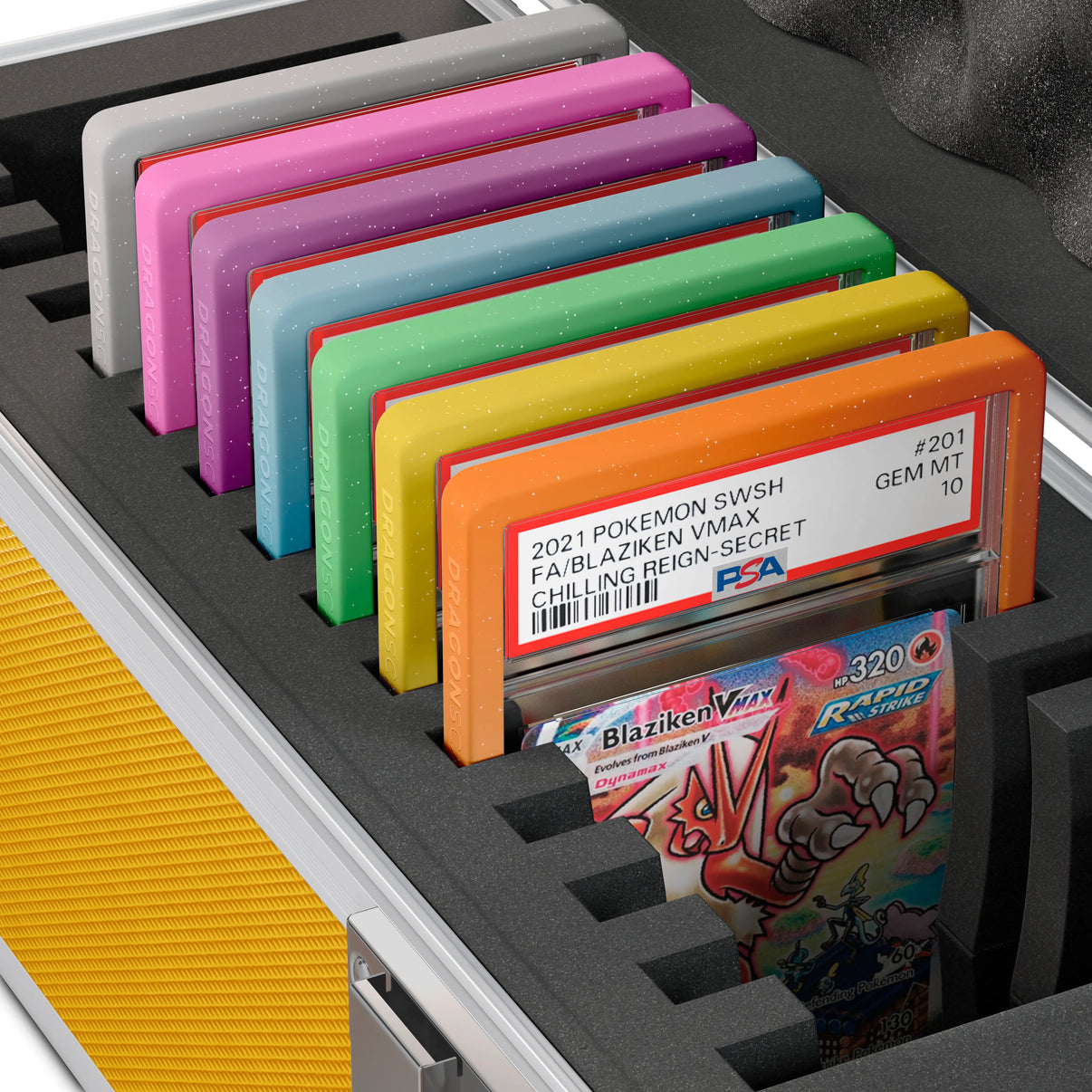 Close-up of the Dragonscale X-15 Precision metal slab case in shiny gold foam slot securely holding PSA slabs with Dragonscale guards.