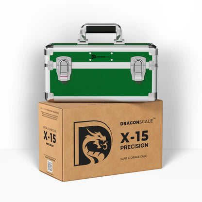 Display and demo view of the Dragonscale X-15 Precision metal slab case in emerald green, placed on top of its branded cardboard packaging box.