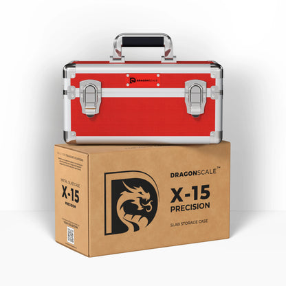 Display and demo view of the Dragonscale X-15 Precision metal slab case in ruby red, placed on top of its branded cardboard packaging box.